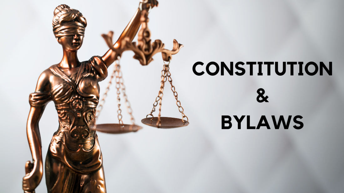 lady justice holding the scales of justice with text that reads constitution and bylaws