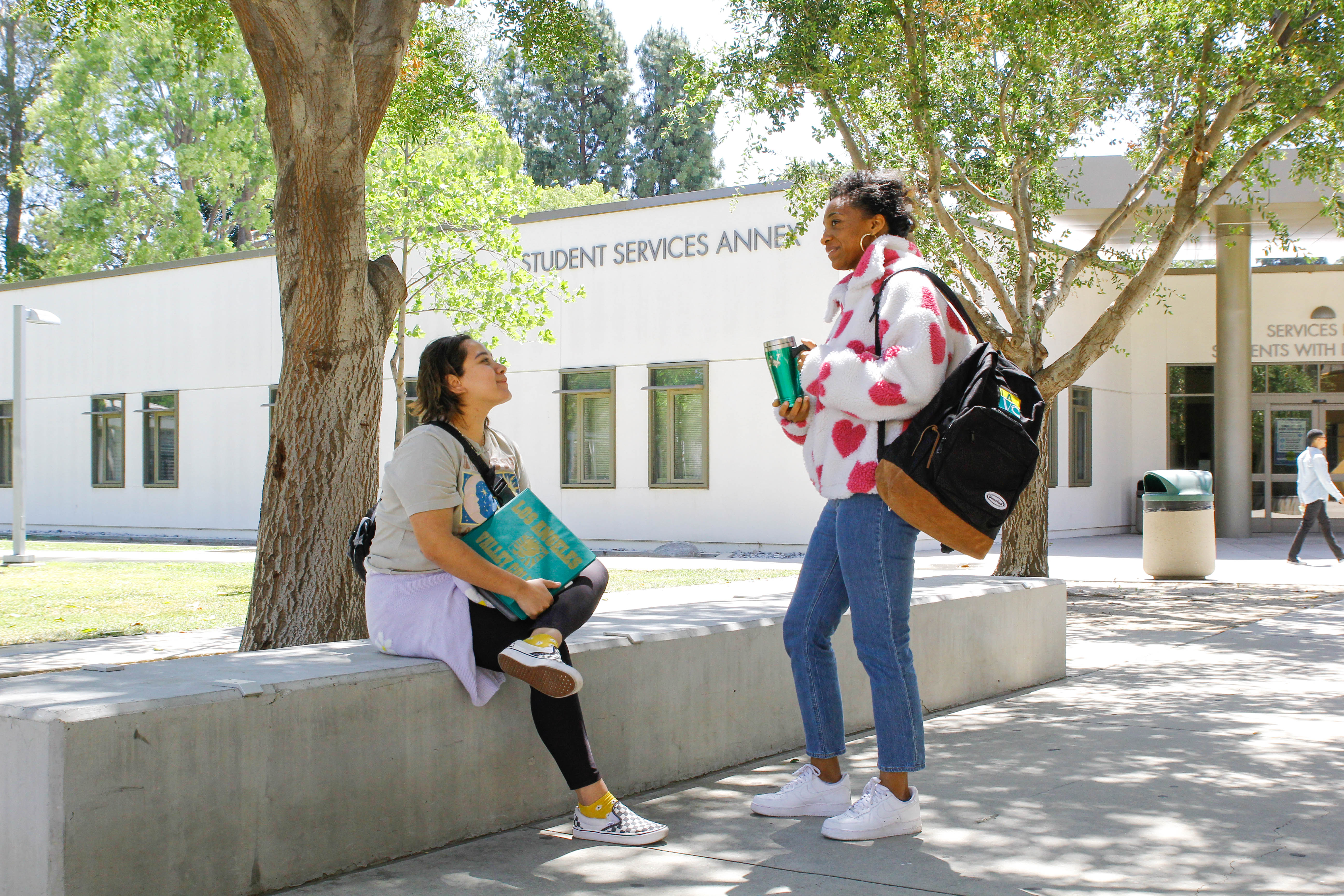 Two Students Talking on Campus
