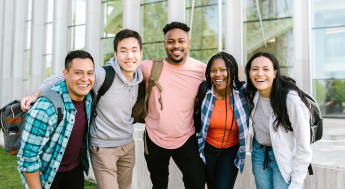 Diverse group of college students smiling at camera