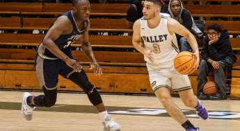 Men's Basketball player dribbling the basketball