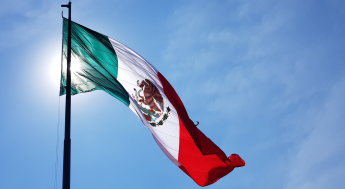 Mexican flag waving on a flagpole