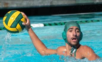 Men's Water Polo player holding a ball