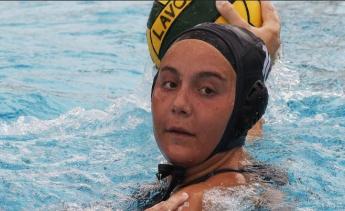 Women's Water Polo player holding a ball