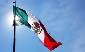 Mexican flag waving on a flagpole