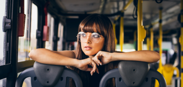 Female sitting inside a bus