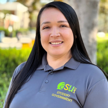 Image of Monica F. wearing an ASU Polo with a tree lined background